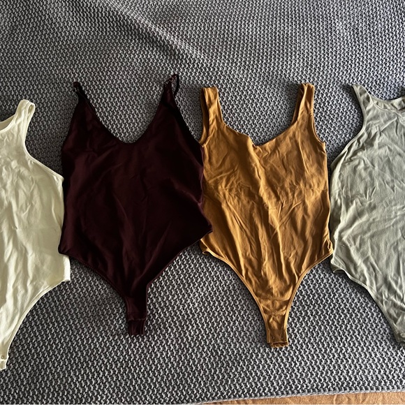 Free People Bodysuits in Cream, Dark Brown, Mustard, and Light Gray - Picture 1 of 5